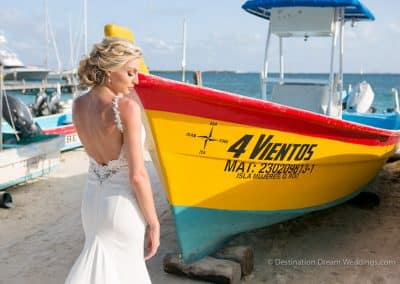 beautiful bride in front of boat