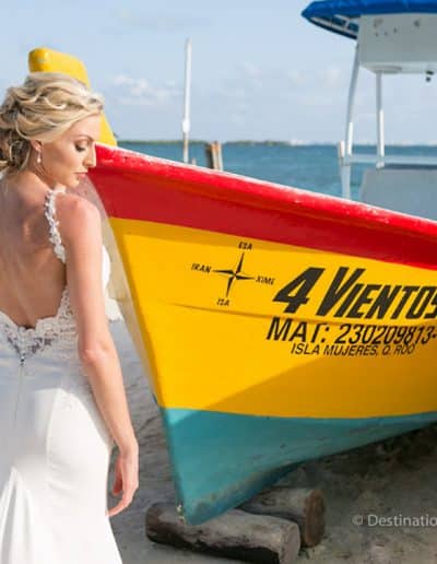 beautiful bride in front of boat