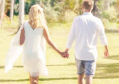 bride and groom walking away